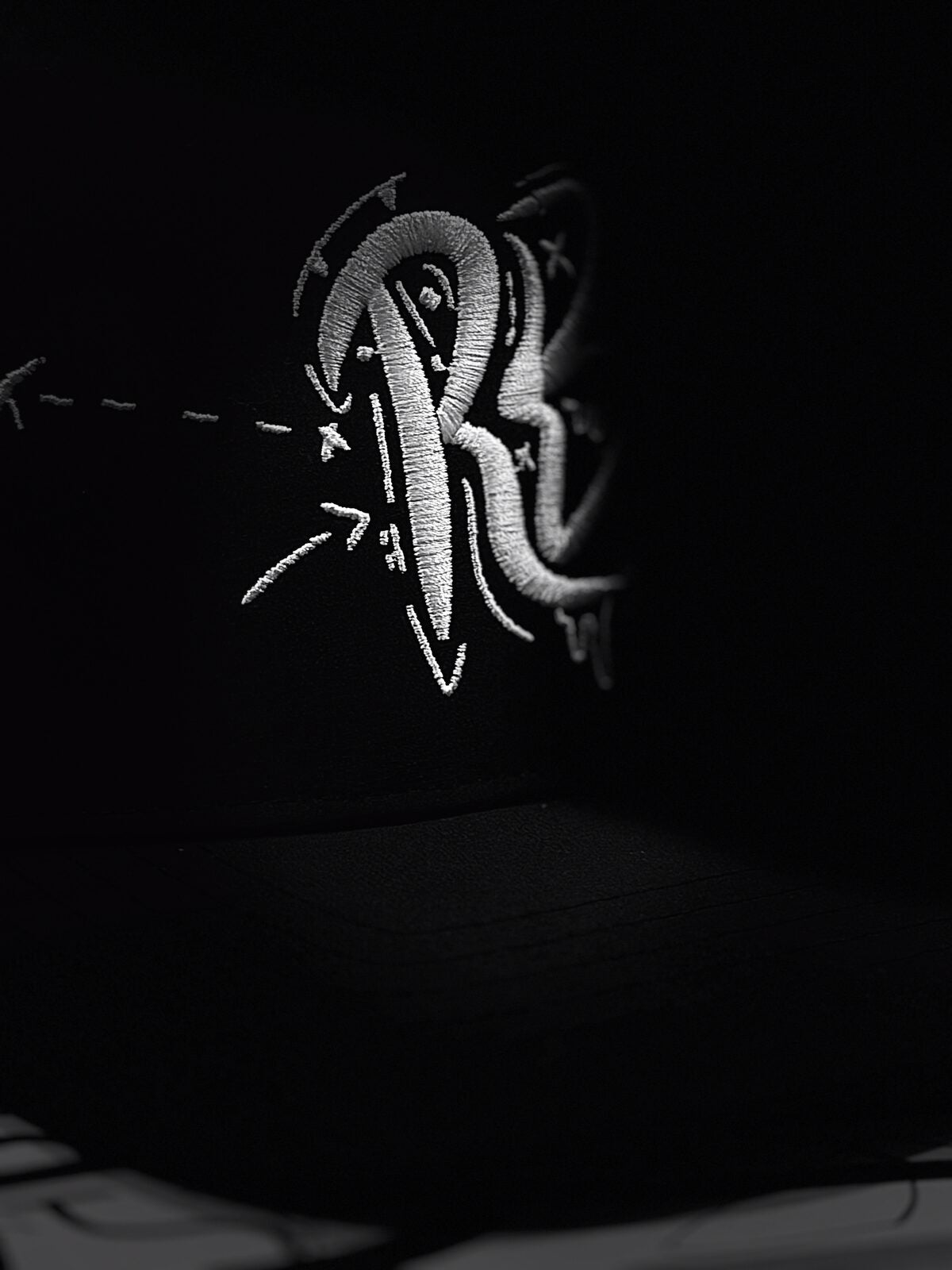 RB monogram 3D embroidery, macro real photograph